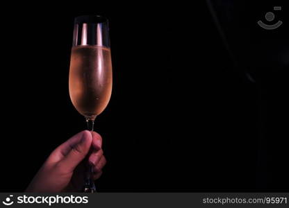 Christmas or New Year Celebration people hands with crystal glasses full of champagne near the Christmas tree and space for your text