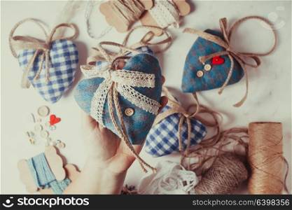 Christmas or Valentine vintage decor - bolue gingham hearts sewing preparations. Christmas felt hearts