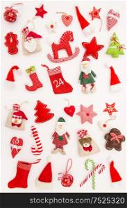 Christmas ornaments and decorations on white background. Winter Holidays greetings card. Red toys