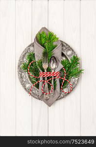 Christmas ornaments. Festive table place setting decoration with christmas tree brunches