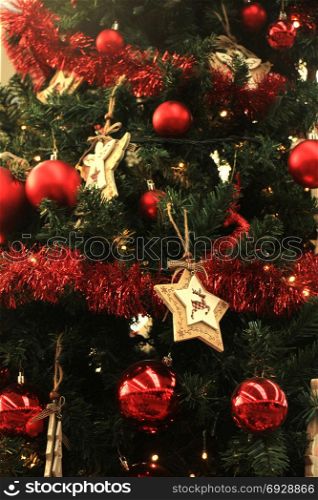 Christmas ornaments in red and white in a tree in a christmas retail shop