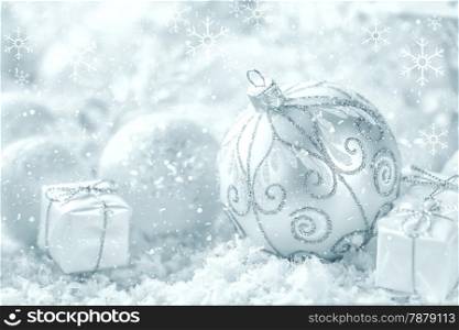 Christmas ornaments on snow