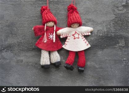 Christmas peg dolly ornament on rustic style grunge background
