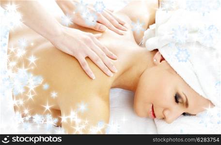christmas picture of lovely lady relaxing in massage salon
