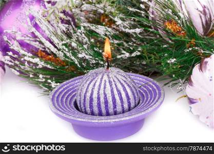 Christmas pink balls, candle and fir tree on white background.