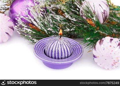 Christmas pink balls, candle and fir tree on white background.