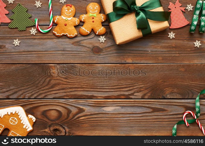 Christmas present and decoration on wooden background
