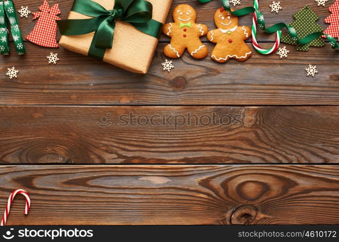 Christmas present and decoration on wooden background