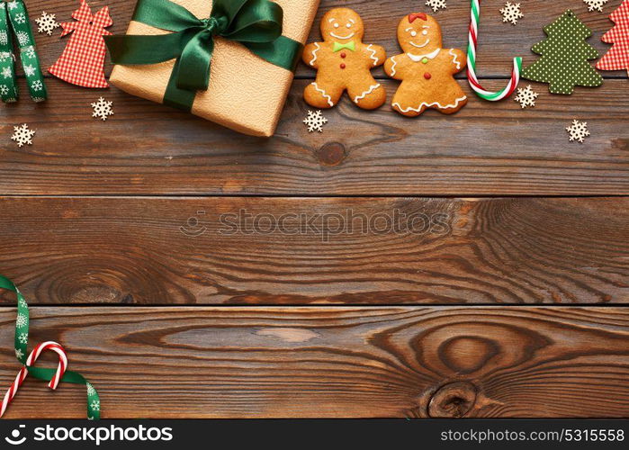 Christmas present and decoration on wooden background