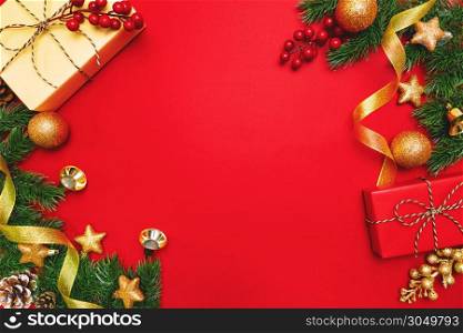 Christmas present and pine tree with xmas decoration on Red background
