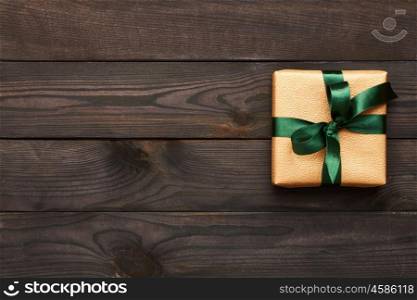 Christmas present on dark wooden background