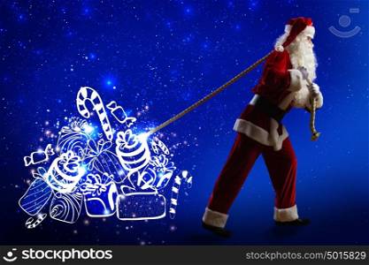Christmas present. Santa Claus pulling bag with Christmas gifts