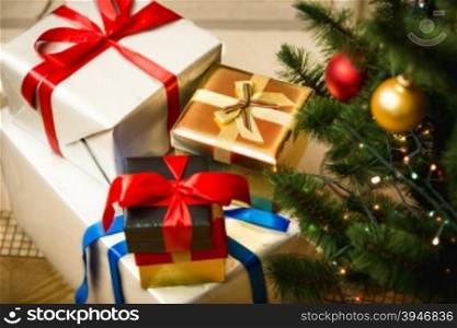 Christmas presents in colorful boxes on floor at living room