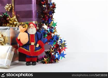 Christmas presents with a model Santa