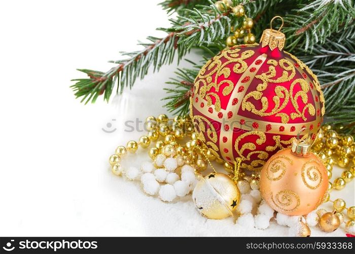 christmas red and golden ball with evegreen tree in snow on white. christmas red and golden heart with evegreen tree