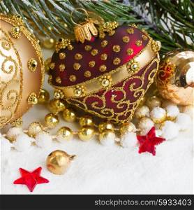 christmas red and golden heart with evegreen tree in snow . christmas red and golden heart with evegreen tree