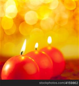 christmas red candles round shape in a row on bokeh golden background