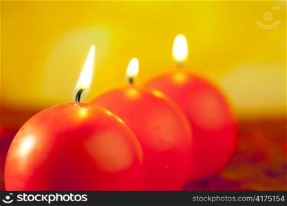 christmas red candles round shape in a row on bokeh golden background