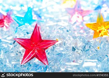 christmas red glass star on winter ice background