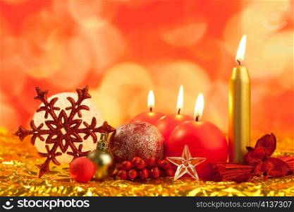 christmas red snowflake with candles on bokeh lights background