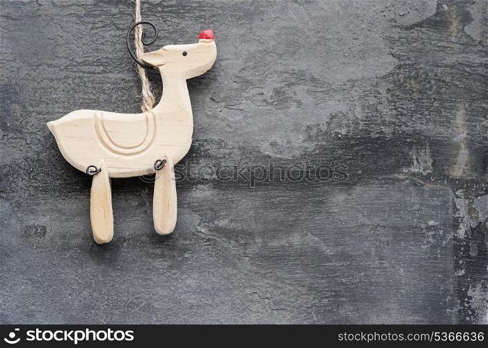 Christmas reindeer ornament on rustic style grunge background