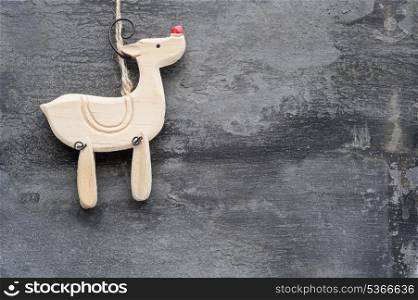 Christmas reindeer ornament on rustic style grunge background