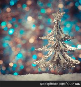 Christmas retro tree toy over defocused background