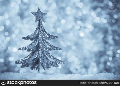 Christmas retro tree toy over defocused background