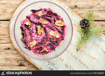 Christmas salad with beets, prunes and nuts. Beet salad with prunes