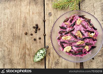 Christmas salad with beets, prunes and nuts. Beetroot salad with prunes
