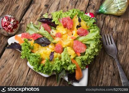 Christmas salad with citrus. Christmas salad with citrus in the shape of a Christmas tree