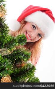 Christmas santa girl face behind a decorated fir-tree.