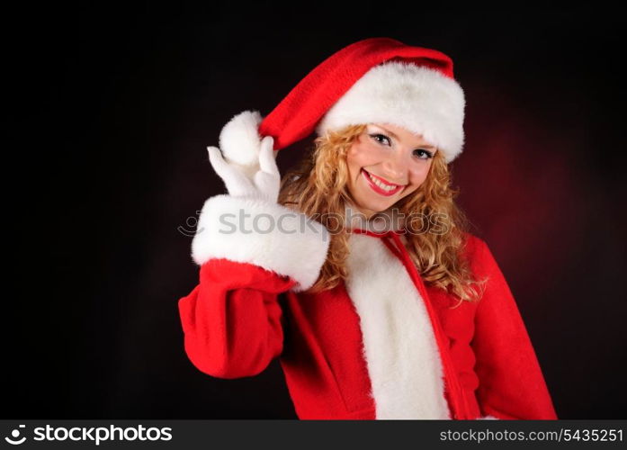 Christmas santa girl on black. Copy text. Christmas greetings card