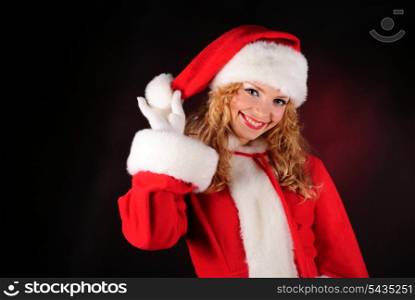 Christmas santa girl on black. Copy text. Christmas greetings card