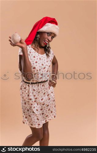 Christmas Santa hat woman portrait. Smiling happy girl on beige background