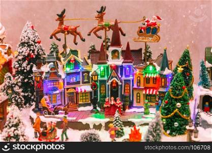 Christmas scene on the shopwindow. Santa Claus, Christmas tree and toys at a Christmas souvenir market shop in Strasbourg, Alsace, France