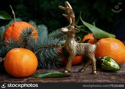 Christmas scene with fresh tangeines and deer. Christmas scene with tangerines