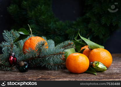 Christmas scene with fresh tangeines friuts and pine. Christmas scene with tangerines