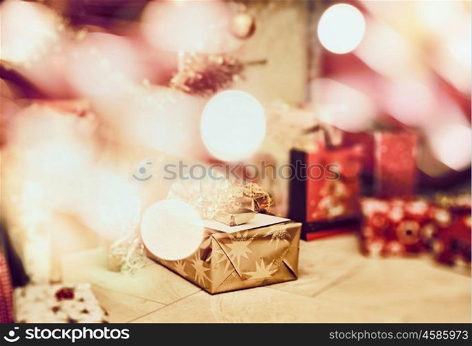 Christmas scene with gifts and festive bokeh , blurred holiday background
