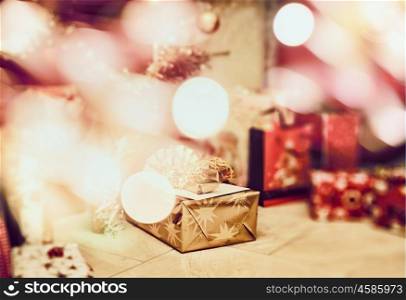 Christmas scene with gifts and festive bokeh , blurred holiday background