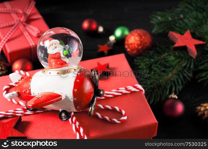 Christmas scene with Santa Claus and red git boxes, Christmas celebration and gift giving concept. Christmas flat lay scene with golden decorations