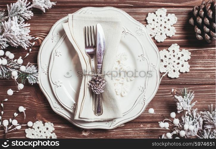 Christmas serving table in shabby chic style. Top view, crochet snowflakes