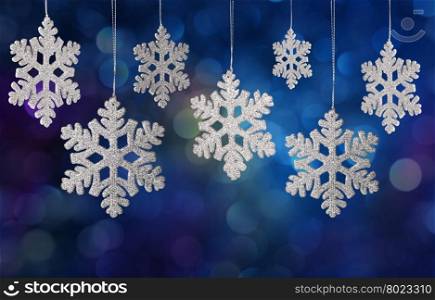Christmas snowflake. Christmas snowflake ornament on a holiday lights background