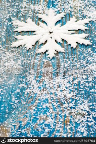 Christmas snowflake ornament on rustic style grunge background