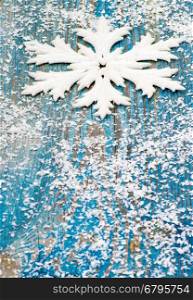 Christmas snowflake ornament on rustic style grunge background