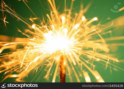 christmas sparkler on green background