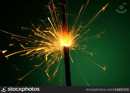 christmas sparkler on green background