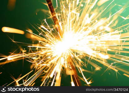 christmas sparkler on green background