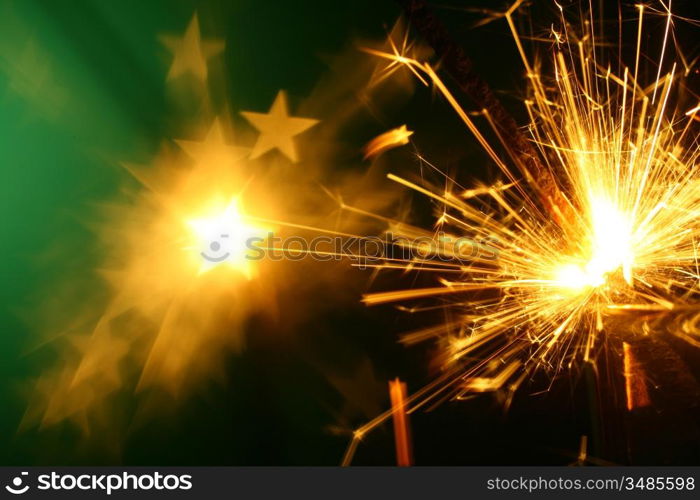 christmas sparkler on green background