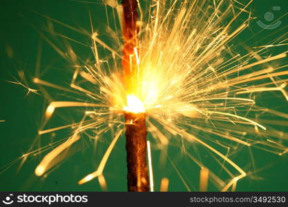 christmas sparkler on green background